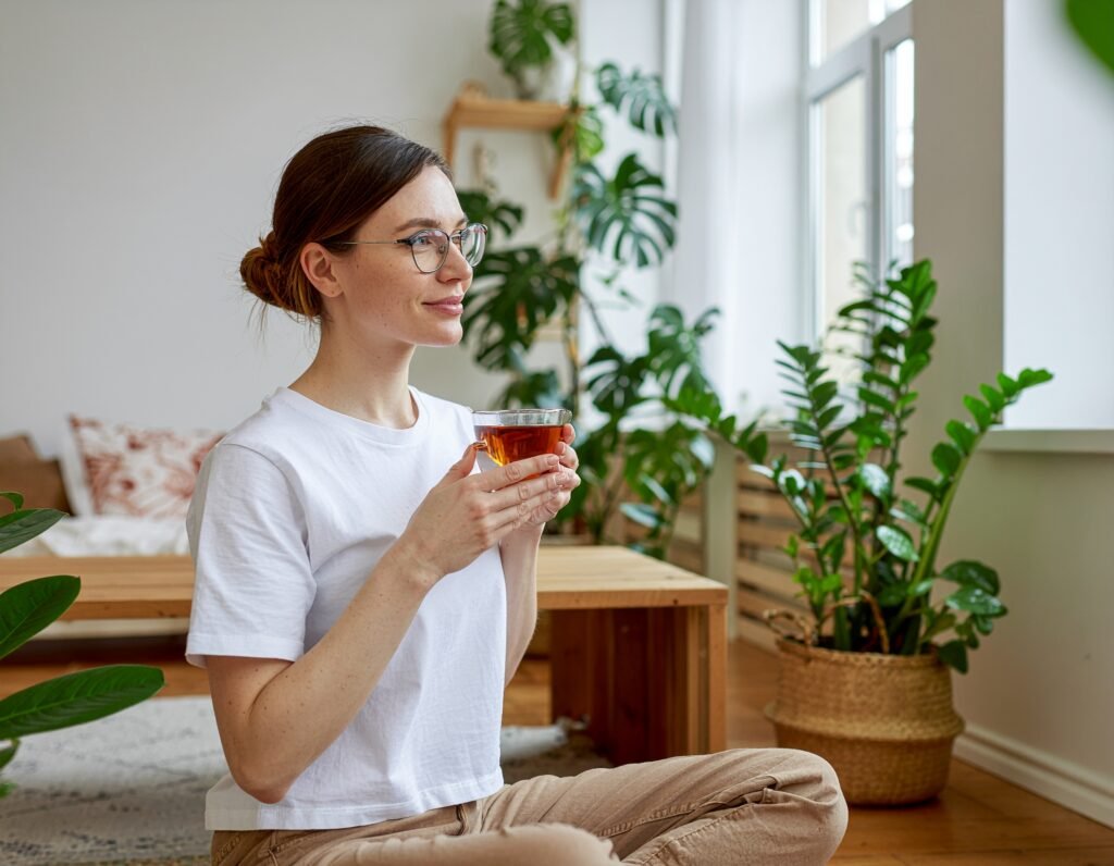 Serene woman sipping herbal tea