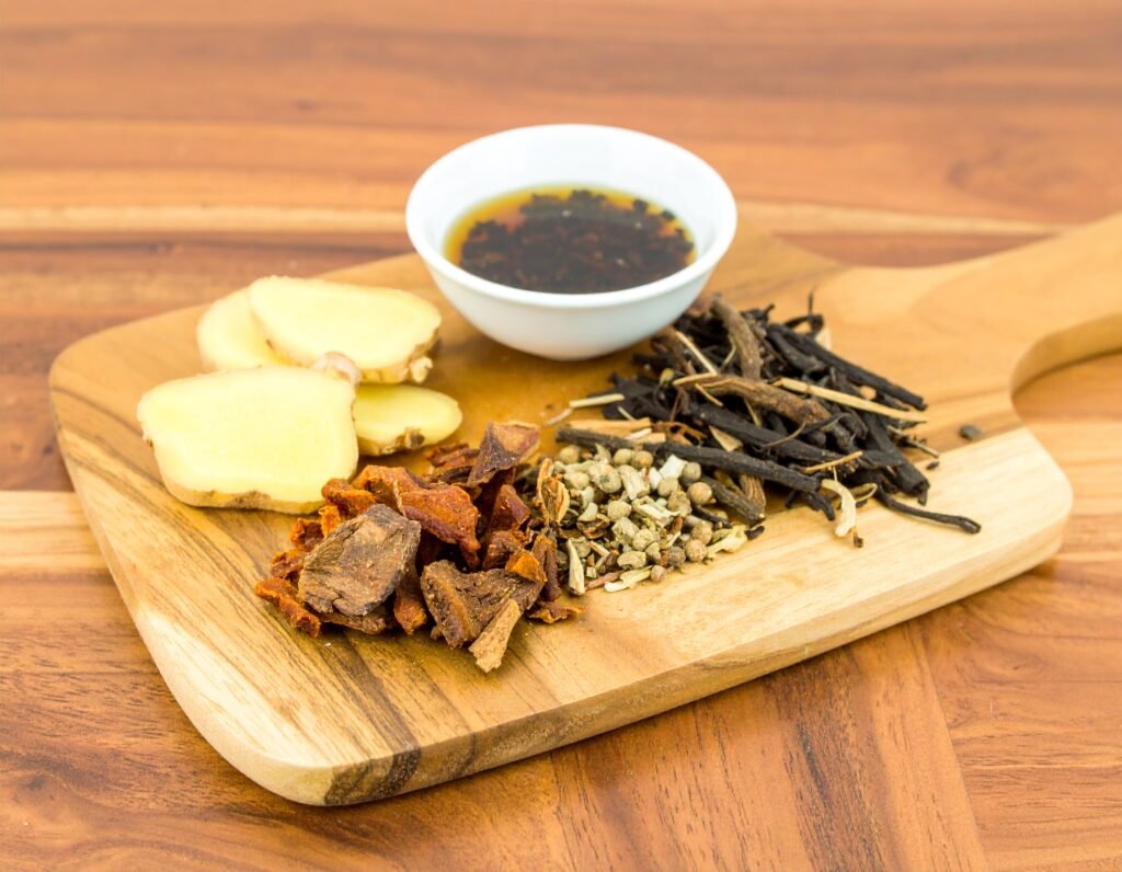 Close-up of ginger, turmeric, burdock, astragalus, licorice roots washed and sliced