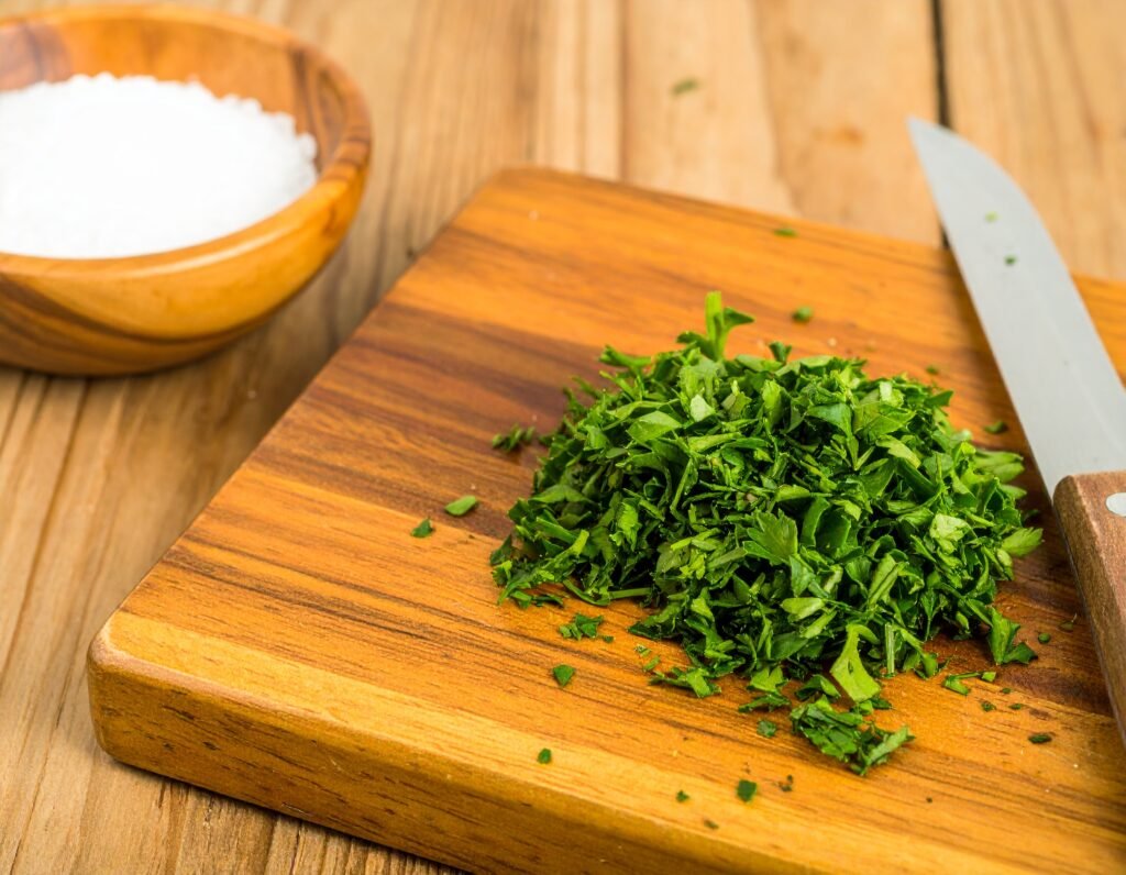 Fresh parsley chopped on cutting board