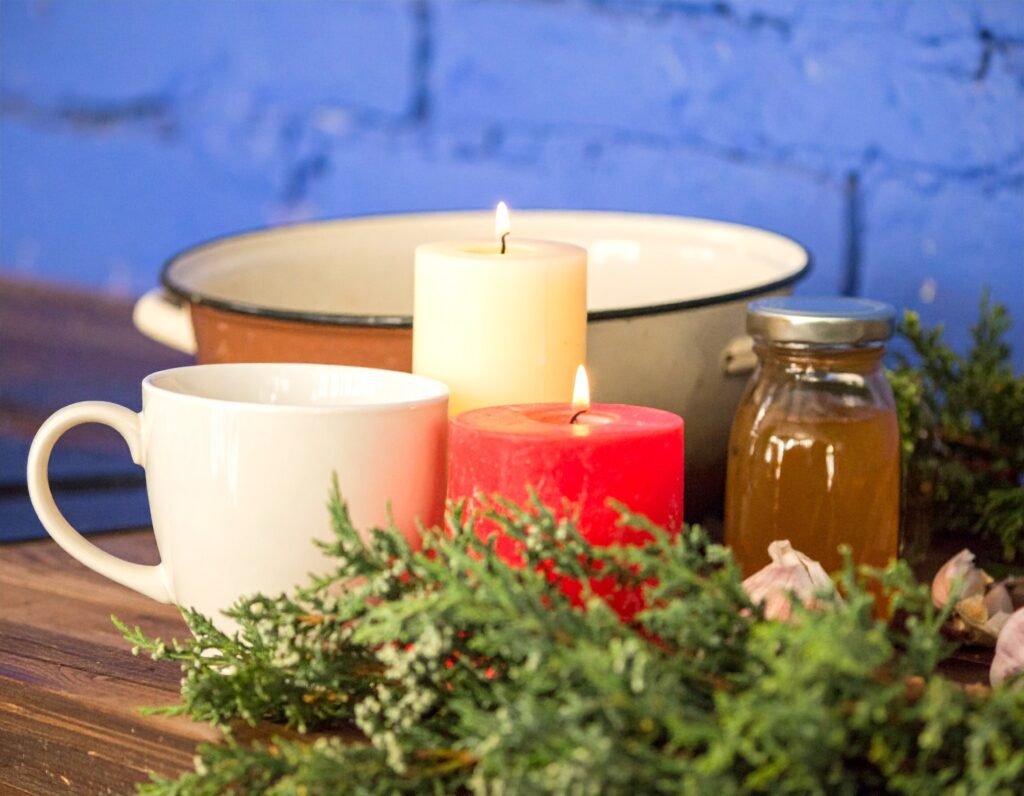 Steaming root teas and jars of honey-ginger syrup on a winter kitchen table