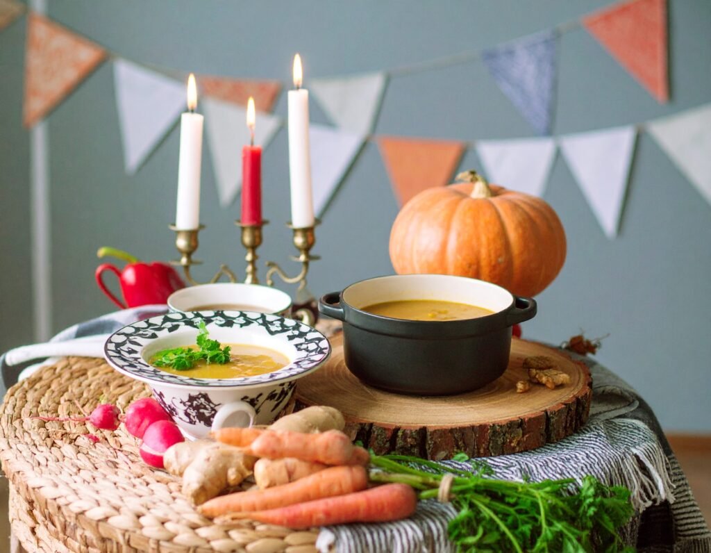 Steaming mugs of ginger turmeric tea and root soup
