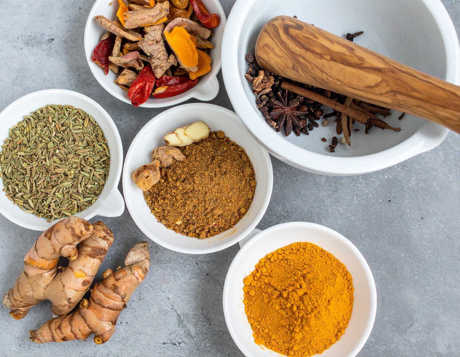 Winter herbal medicine cabinet with ginger, turmeric, and ashwagandha